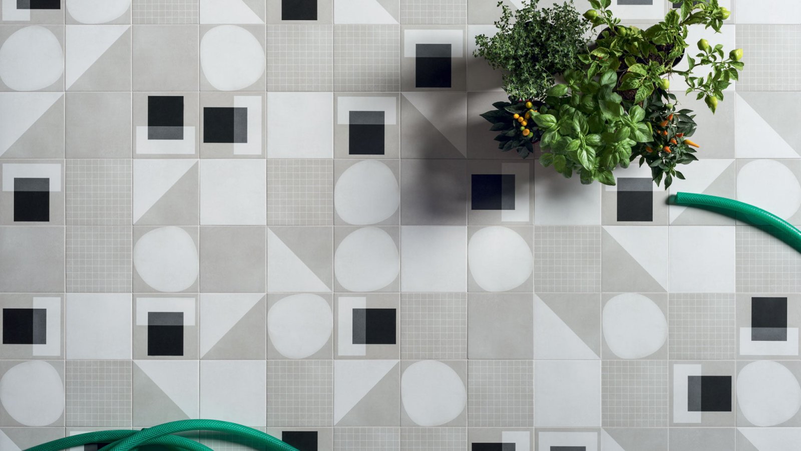 Designer ceramic tile Futura by 41zero42 in a 6x6 inch format on a restroom wall