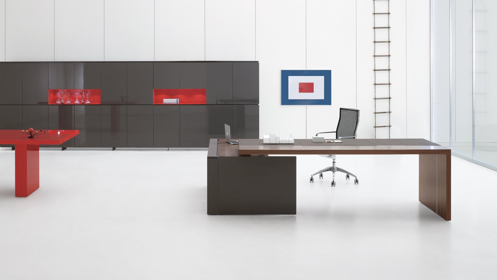Bridge version of the Ar.tu desk over a lacquered storage unit