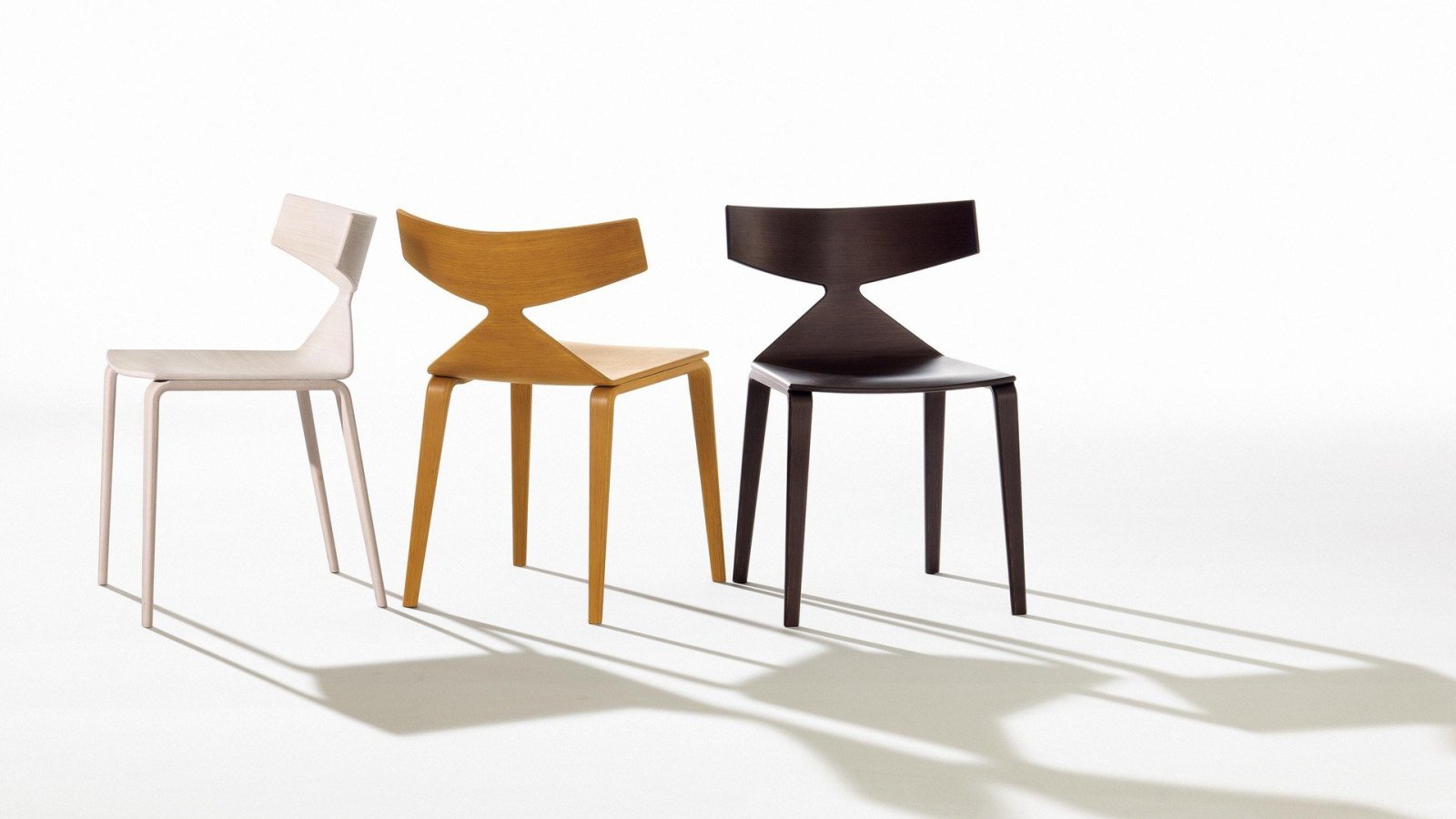 Saya designer chair by Arper with oak veneered shell in a dining room