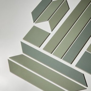 Macro shot of the fifteen shade blend in Mews Pigeon glazed porcelain