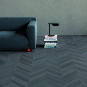 Mutina Mews 2x18 porcelain planks in Ink across a corporate lobby floor