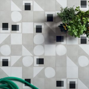Designer ceramic tile Futura by 41zero42 in a 6x6 inch format on a restroom wall
