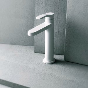 Chrome AL/23 single-hole lavatory faucet by Fantini in front of raw gray concrete
