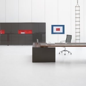 Bridge version of the Ar.tu desk over a lacquered storage unit