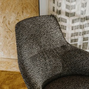 Two chairs with footstools in a lounge
