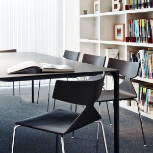 Arper Saya chair paired with a solid wood table
