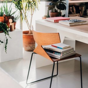 Saya bar stool by Arper on a steel sled base at a counter