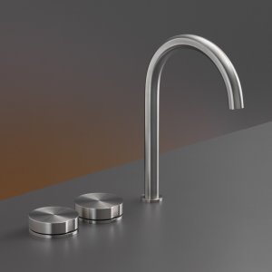 Three-hole Giotto basin set by Cea Design on a stone countertop