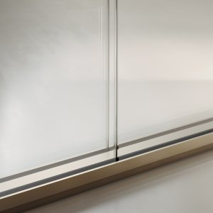 Slender solid partition with walnut veneer panels