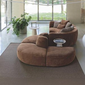 Two half-moon pieces from the Cloud collection floating in open floor