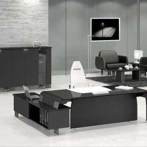 Corner office with AlfaOmega desk, equipped extension and curved-side bookcase