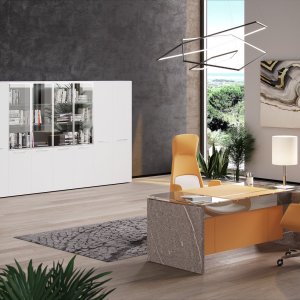Mirror-polished stainless steel beam under the walnut top of a One desk