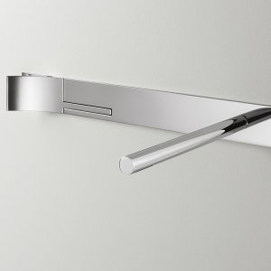 Close-up of the Cut Plus wall-mounted faucet in polished steel