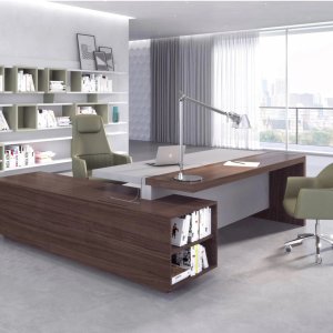 Ducale desk by Estel with the service cabinet set across its end and a bookcase behind