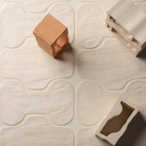 Close look at the uneven edges of Faces & Figures tile