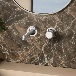 Deck-mount Flora tub set by Fantini, hand shower included, on the tub rim