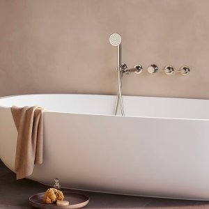 Acquafit showerhead from the Flora line set flush in the ceiling, nozzle pattern visible