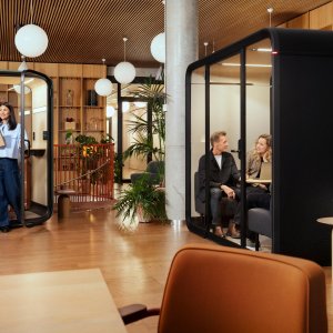 Adjustable stool and footrest inside the Framery One Compact pod