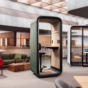 Row of Framery One Compact booths across an open plan floor