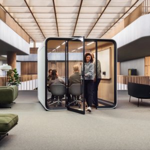 Team of six meeting inside the Framery Six pod