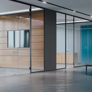 Executive office fronted by a slim framed glass partition wall