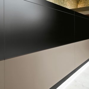 Aluminum cable flap opened on the worktop of the Vogue desk