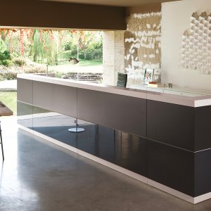 Vogue reception desk in greenish gray lacquer with light elm panels