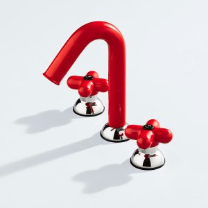Fantini round rain head mounted on a wall arm in a tiled shower