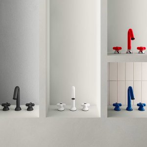 Blue I Balocchi wall-mount lavatory faucet set into a stone slab