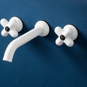 I Balocchi three-hole lavatory faucet by Fantini, red with chrome, on a blue sink