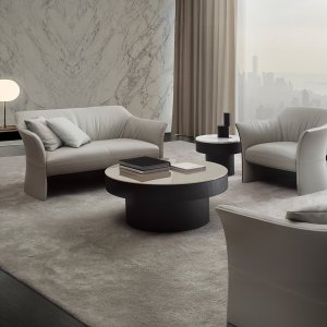 Sella tub armchair on glides in a reception
