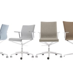 Stick Chair conference room chairs by ICF Office in a glass-walled boardroom