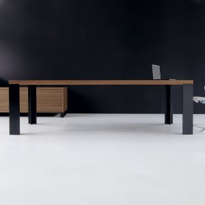 Walnut veneer desktop on the New Loop executive desk