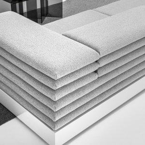 Square ottoman from the Acamante collection next to a LaCividina sofa