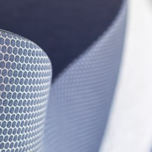 Stitching detail on the upholstered Nautile guest chair