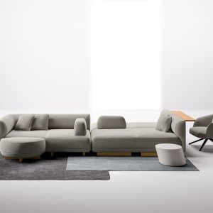Upholstered LaCividina divider 61 3/4 in tall framing a lounge corner