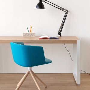 Cut chairs around a meeting table in mixed finishes