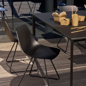 Miunn stools lined along a hotel bar