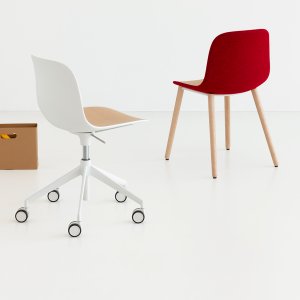Four screws securing the seat insert of the Seela chair