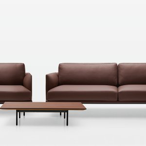 New York ottoman by Quinti next to the two-seater sofa