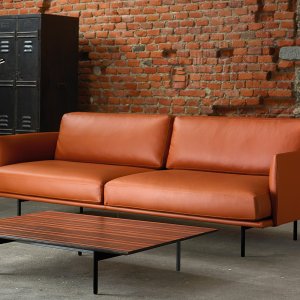 New York two-seater sofa by Quinti in tan leather on black tubular steel legs