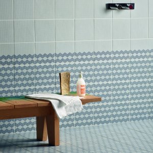 Office interior with a Tape by Mutina half pattern fading into the base tile