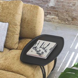 Black ash side table next to a Qubik sofa