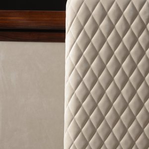 Cabinet shoulder with vertical rod quilting