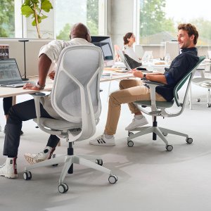 se:kit task chairs with sage upholstered backs around a six-seat bench