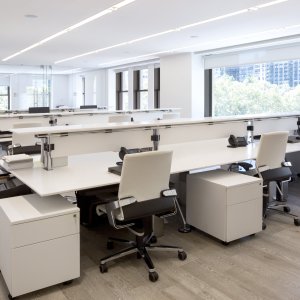 Shared structure Nomos bench carrying four workstations on one backbone
