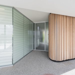 Glazed hinged door with acoustic guillotine in a W80 wall
