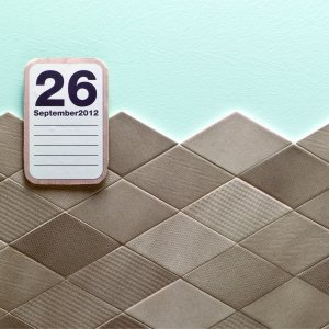Tumbling-blocks illusion built from Tex diamonds in Black and Grey