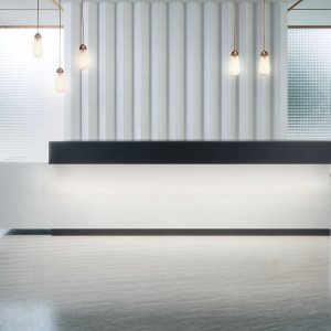 Reception desks Toki by Archiutti with polished monogram on the front panel