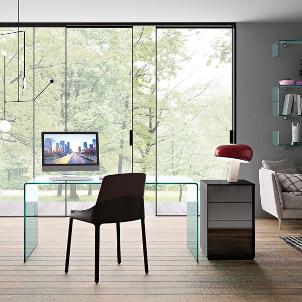 FIAM Ghost curved-glass armchair in a reception
